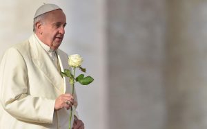 (FILES) Pope Francis brings a white rose to the Virgin Mary during his weekly general audience at St Peter's square at the Vatican on December 9, 2015. Pope Francis died on April 21, 2025 announced The Vatican. (Photo by Vincenzo PINTO / AFP)